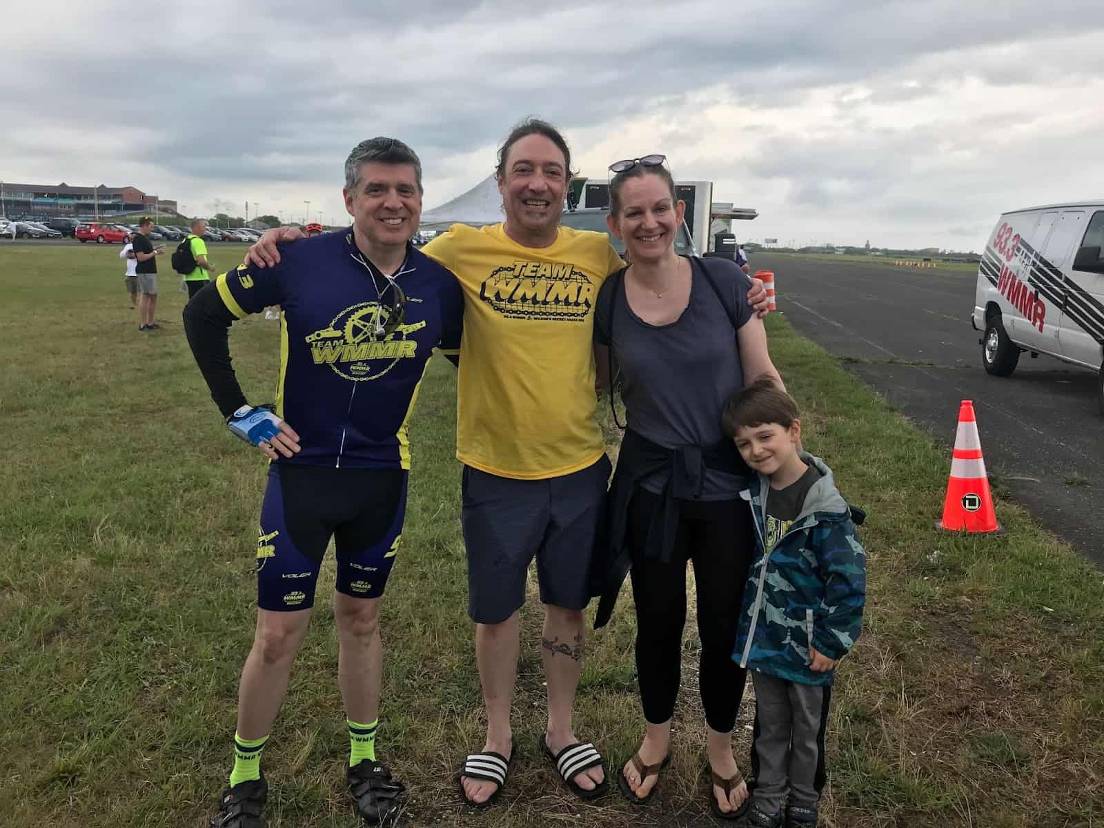 Tamman CEO Jeff Tamburino poses with Markus Goldman of WMMR and his family after the Bike-a-thon.