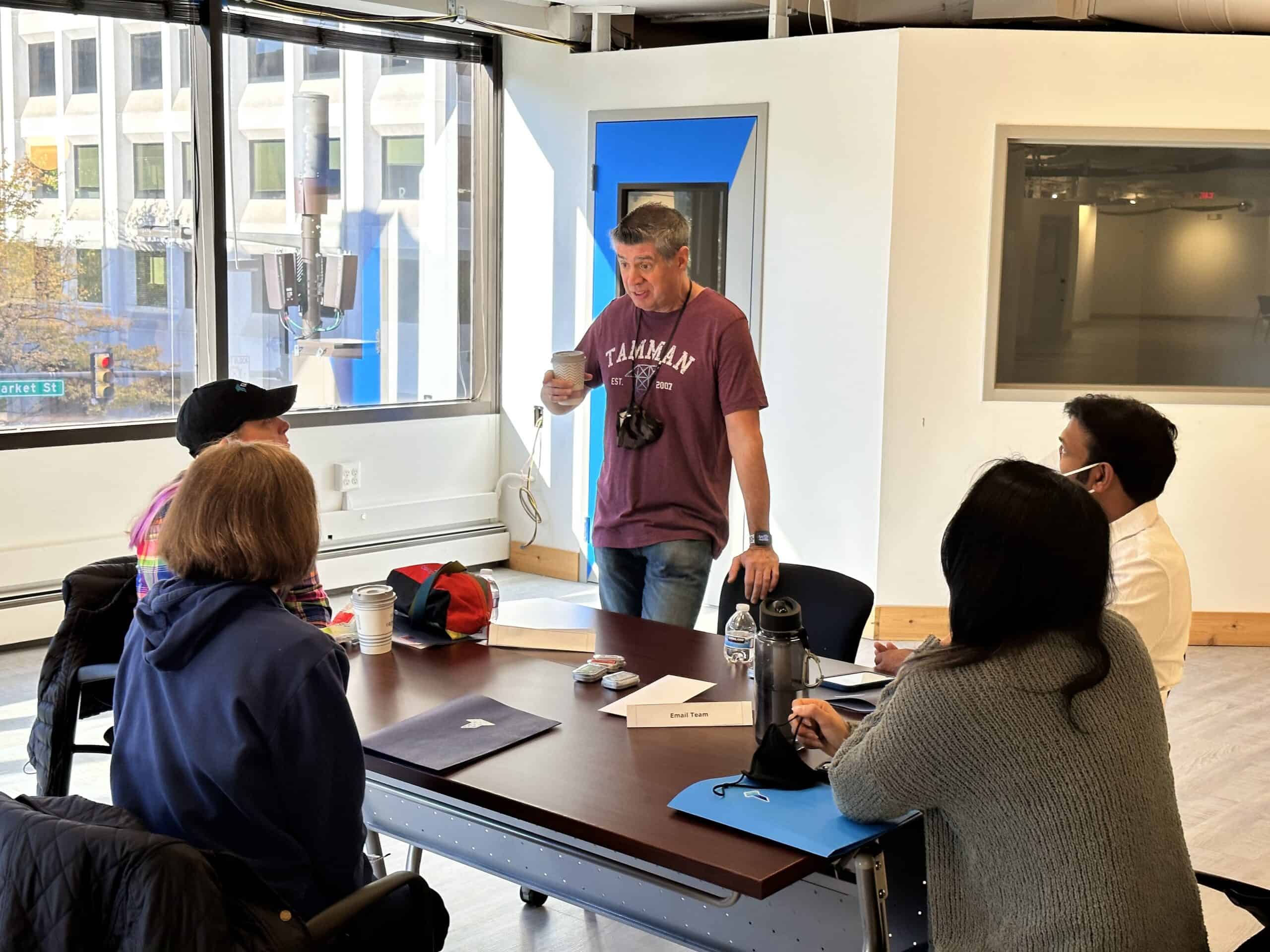 Tamman CEO Jeff Tamburino greets some of the digital designers sitting together with a cup of coffee before the day begins.