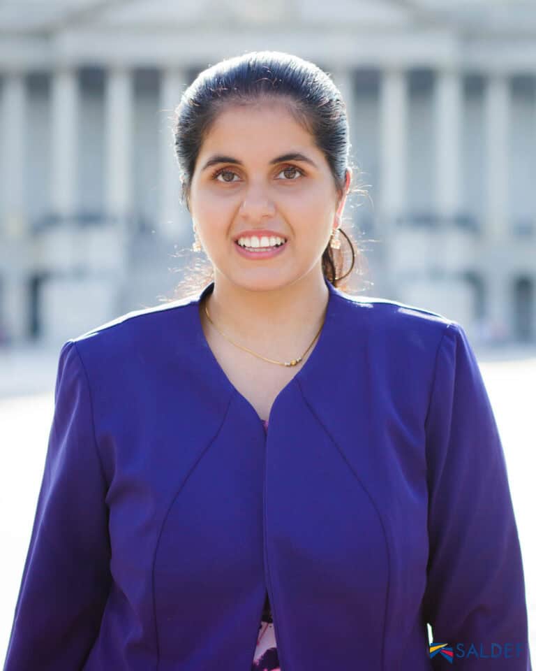 Headshot of Nimit Kaur in a purple blazer, partner and contractor at Tamman