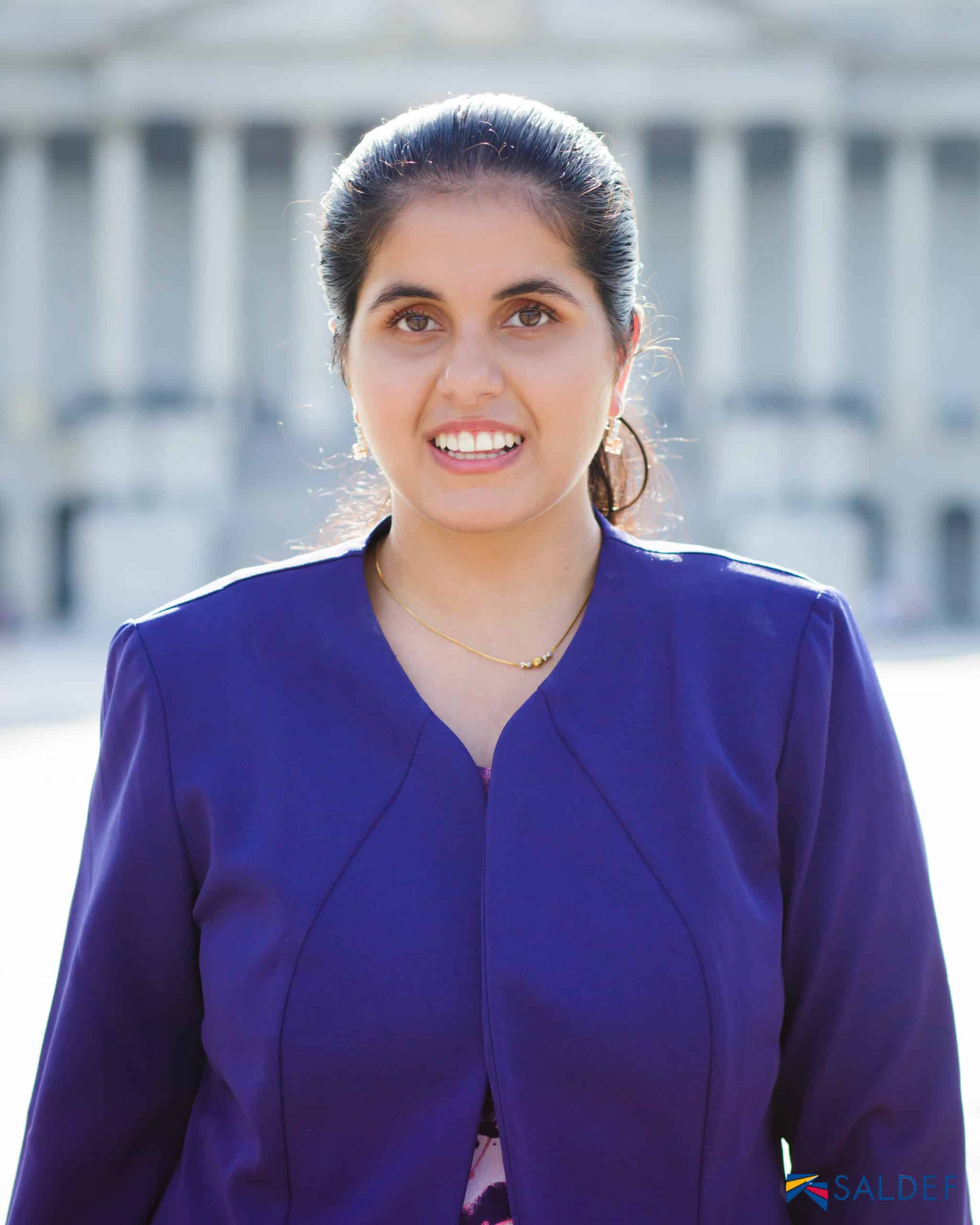 Headshot of Nimit Kaur in a purple blazer, partner and contractor at Tamman