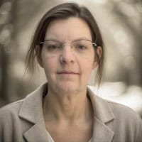 Headshot of Sheri Byrne-Haber wearing glasses and a beige blazer.