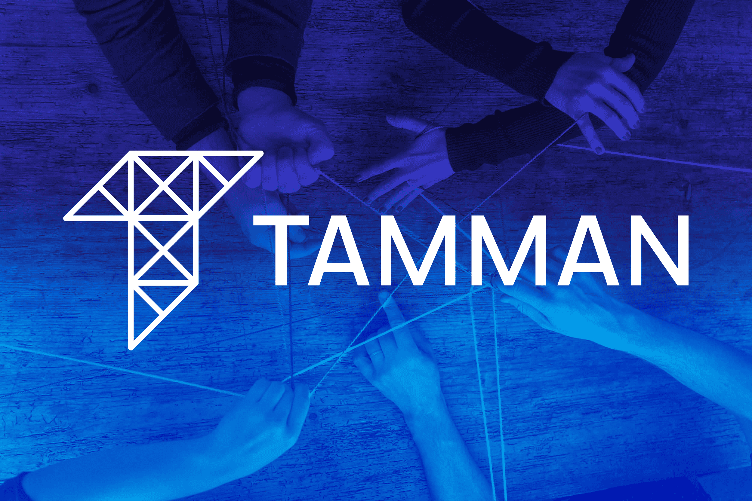Tamman Logo on Hands Holding String