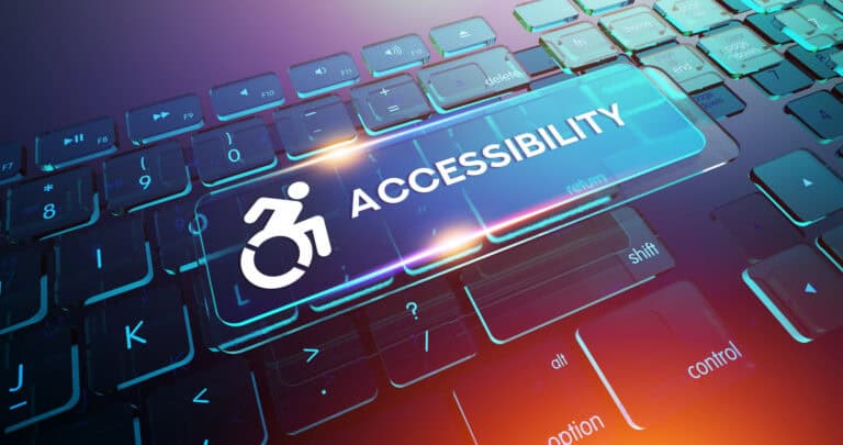 A blue keyboard with a large button showing a person in a wheelchair moving forward and the word "Accessibility" displayed.