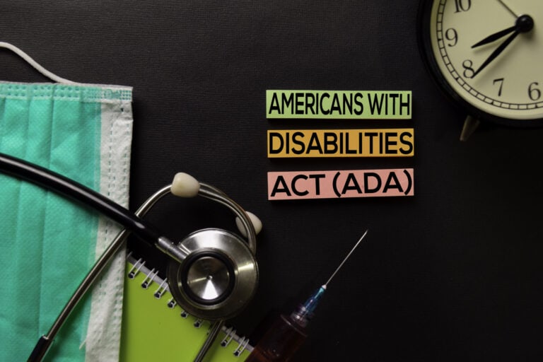 Americans with Disabilites Act (ADA) text on top view black table with blood sample and Healthcare/medical concept.