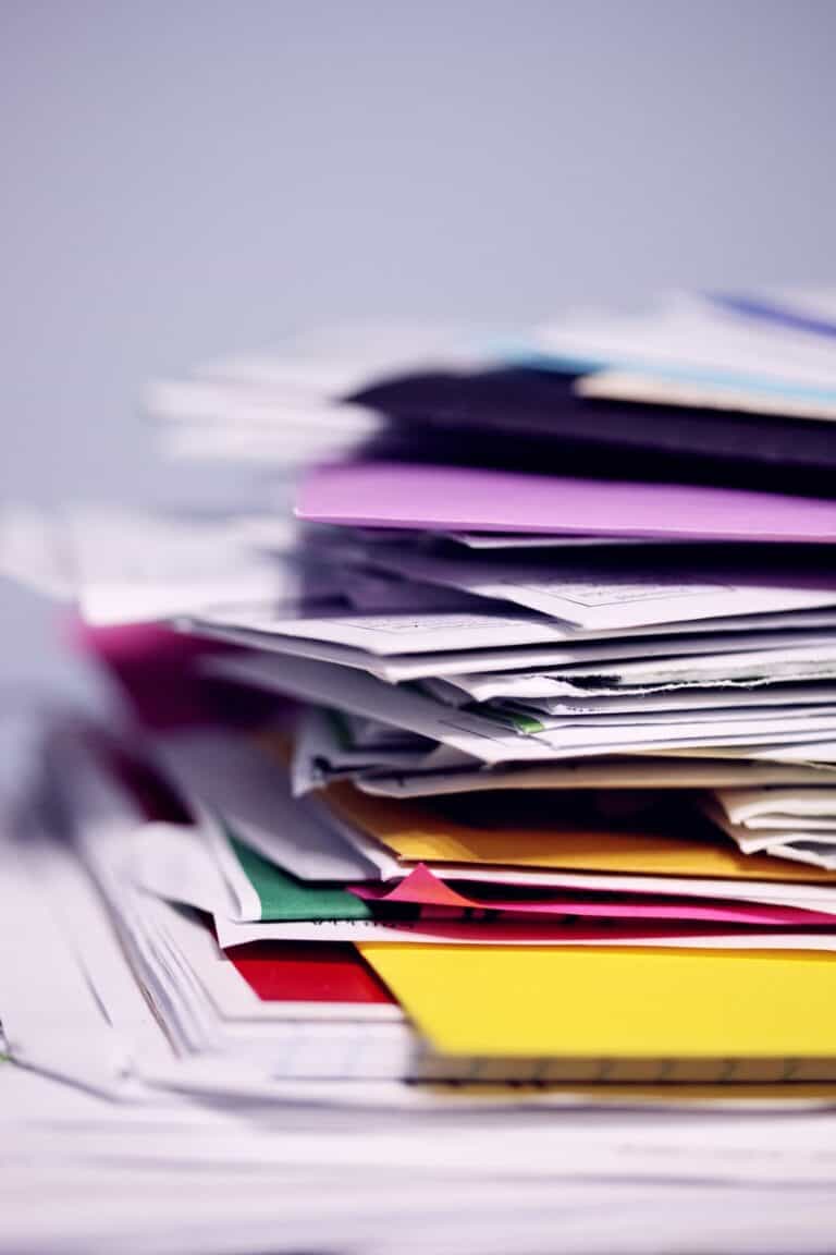 Messy multi-colored pile of folders and documents