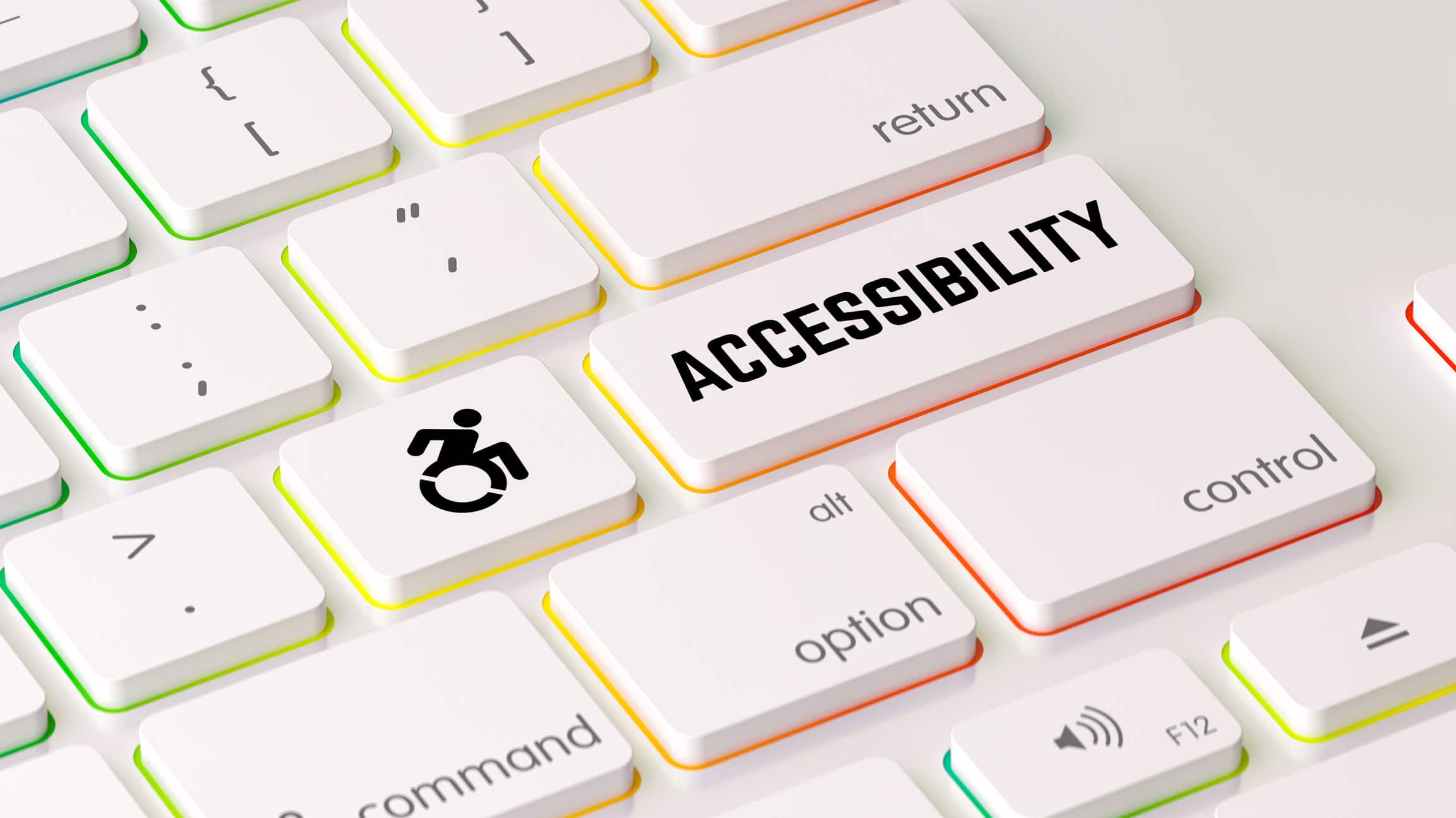 A close up of a white keyboard that has an icon of a person in a wheelchair on one key and the Enter key reads "Accessibility"